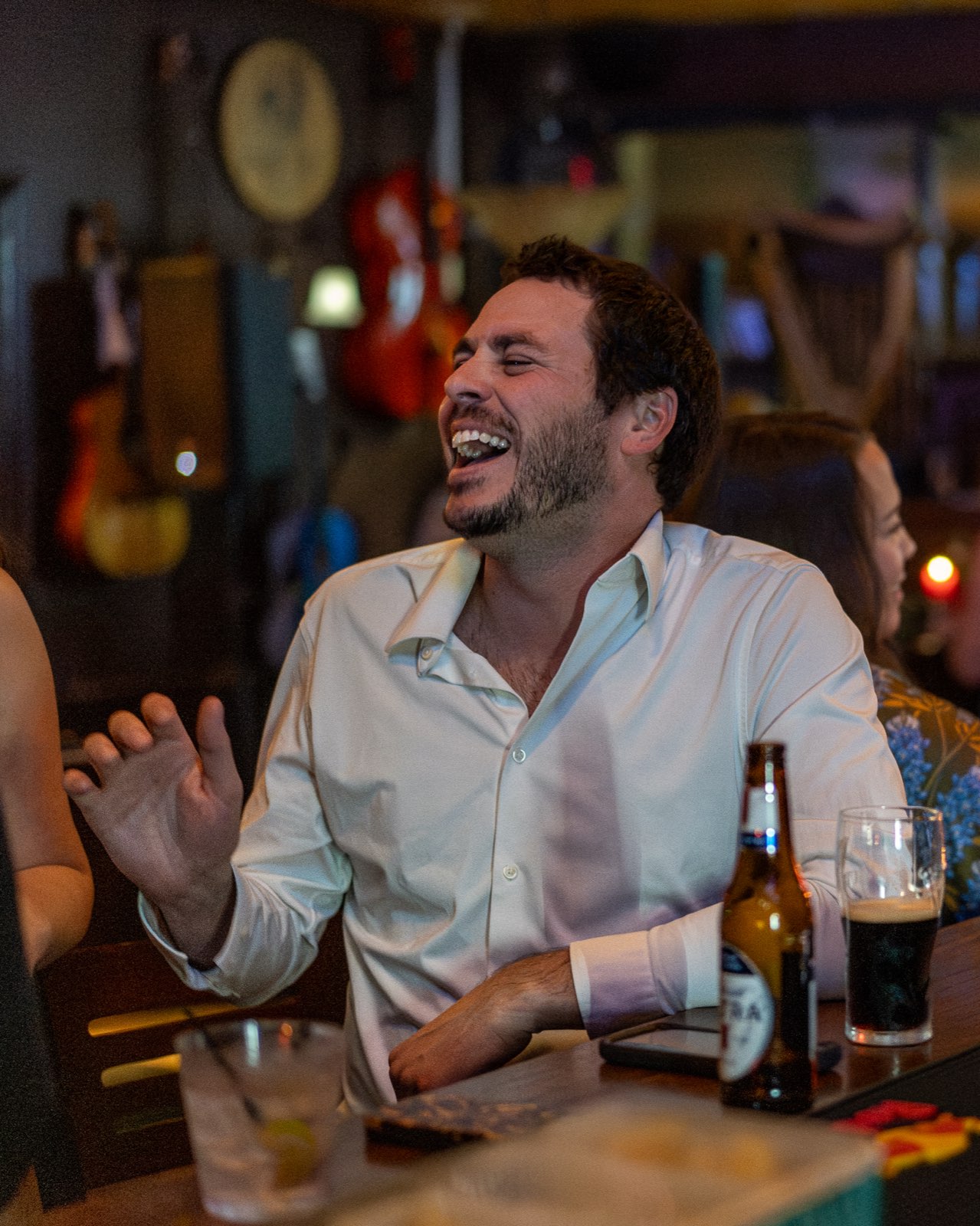 A guest laughing at the bar